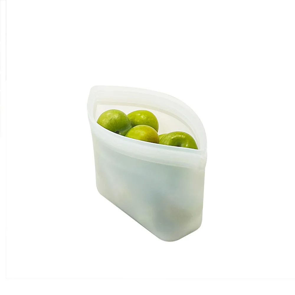 White stand-up silicone food pouch holding green fruit