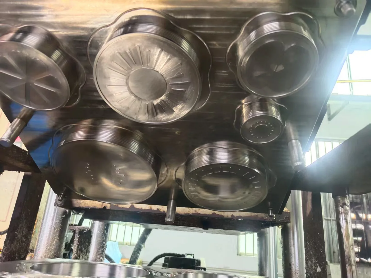 Circular cavities in the upper half of a metal mold